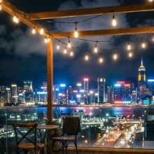 A rooftop bar over a lit city