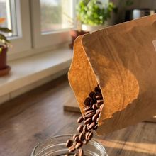 Coffee beans pouring from a bag
