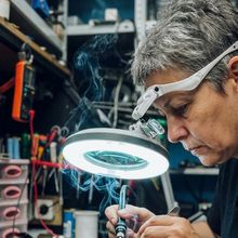 Precision bench work under a magnifier lamp